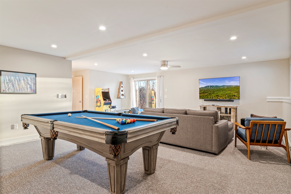 Your Entertainment Hub: Full-size pool table and room to relax after a day on the mountain.