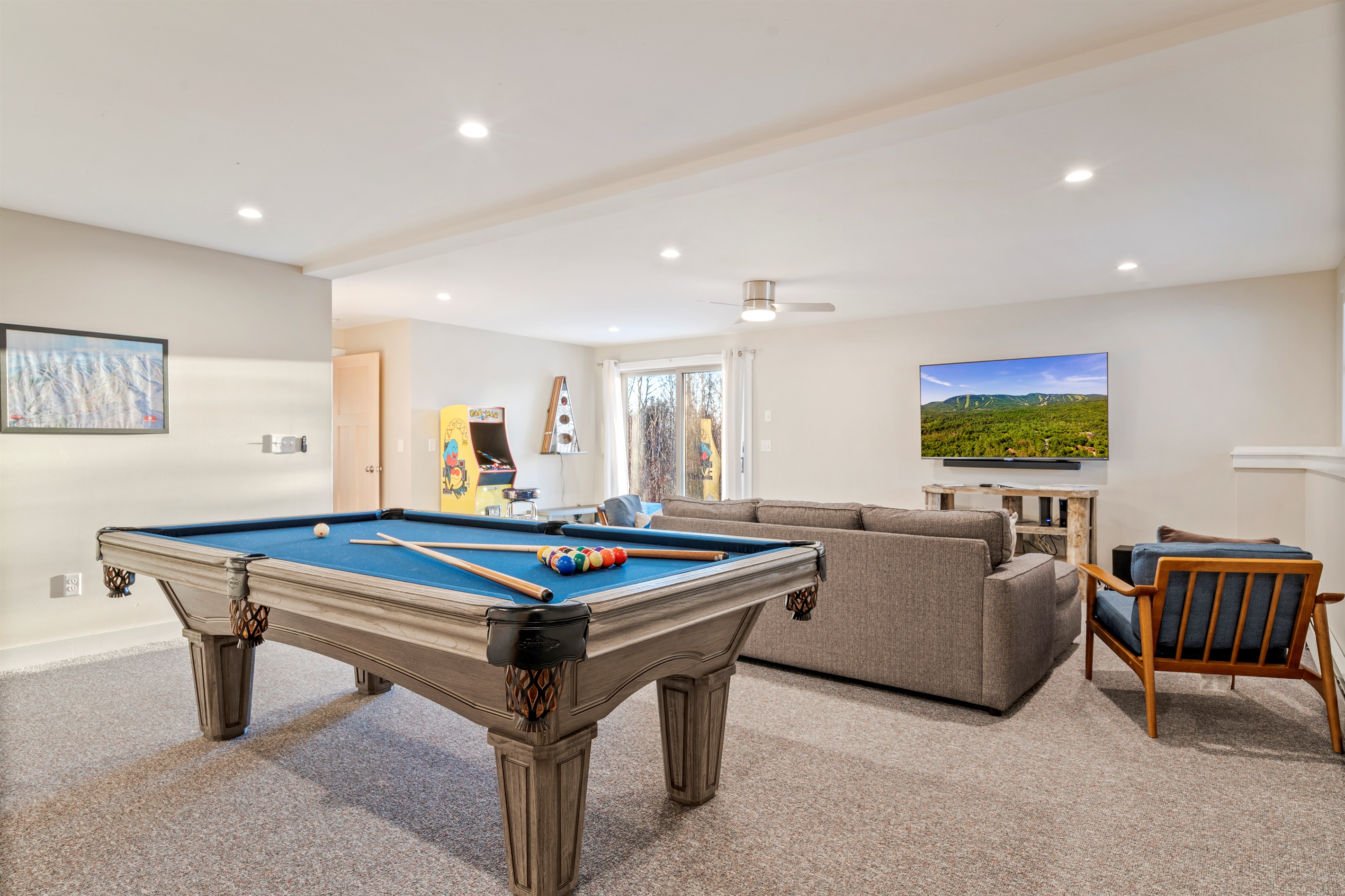 Your Entertainment Hub: Full-size pool table and room to relax after a day on the mountain.