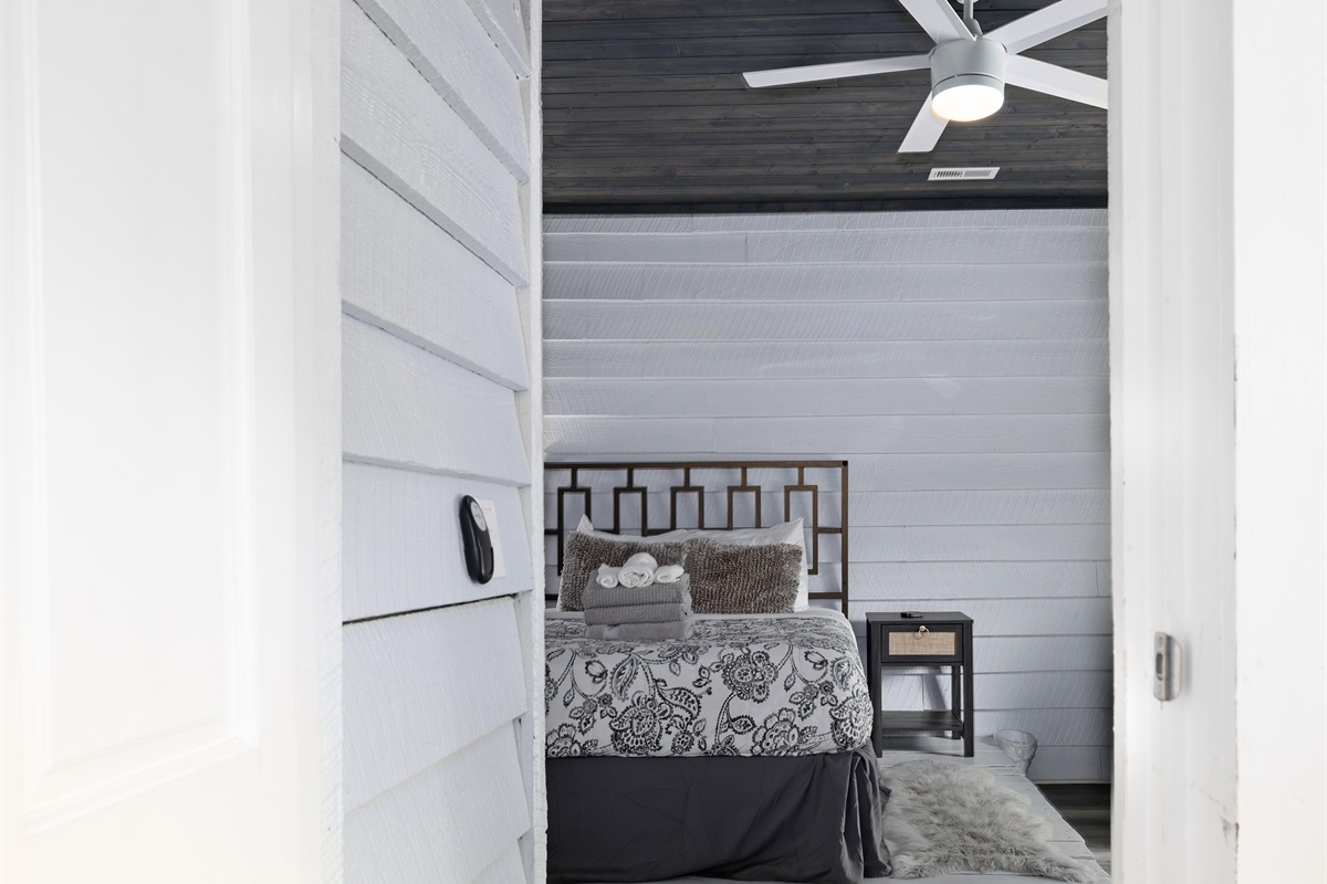 Bedroom 1 with Queen bed, access to deck and ensuite bathroom