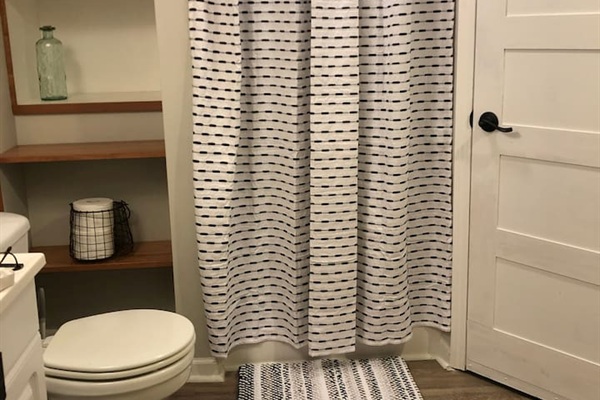 Newly renovated bathroom with shower, new floors and built in storage give you plenty of room to unpack and get comfy. 