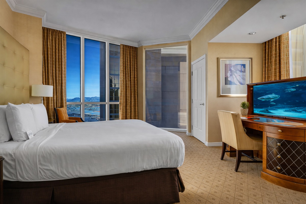 Wake up to stunning cityscapes in this plush bed! 