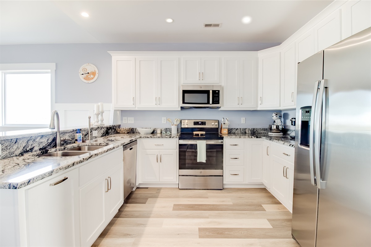 Modern appliances and an open layout keep the kitchen light, functional, and welcoming