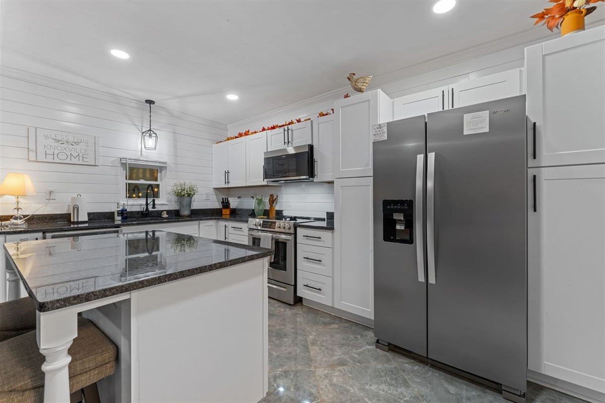 Fully stocked kitchen with premium, energy-efficient appliances and everything you need for cooking, hosting, and family meals