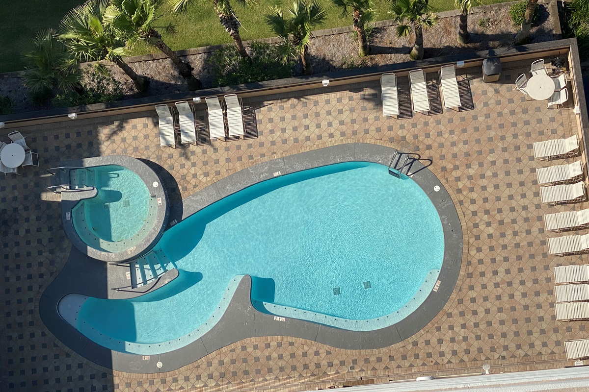 This beautiful outdoor pool and hot tub is located right across the street from the main building, offering a serene escape. Enjoy the convenience of access via our elevated, air-conditioned walkway, connecting you effortlessly to relaxation.