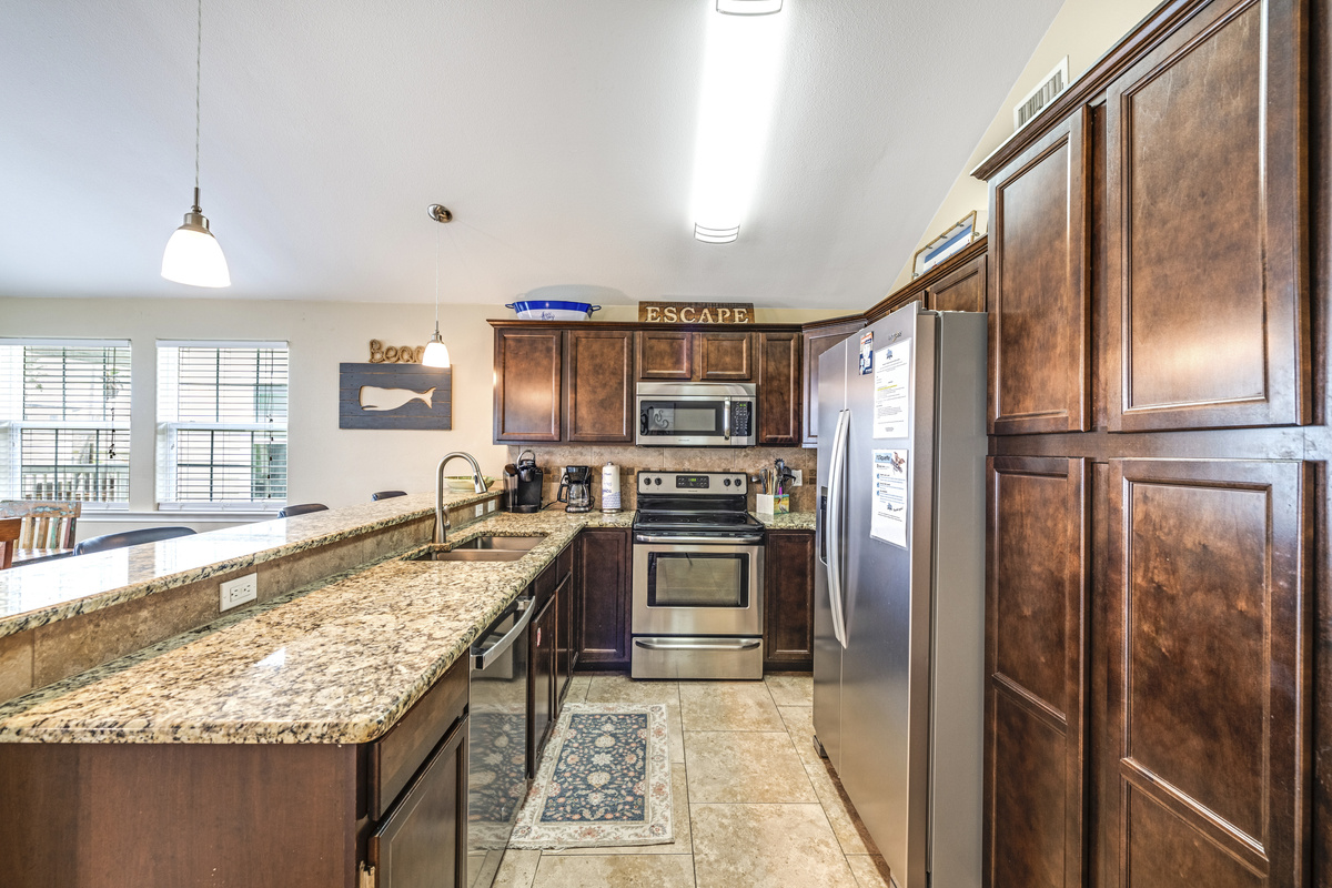 Fully stocked kitchen:  Pots, pans, serving ware, blender, coffee maker, toaster.