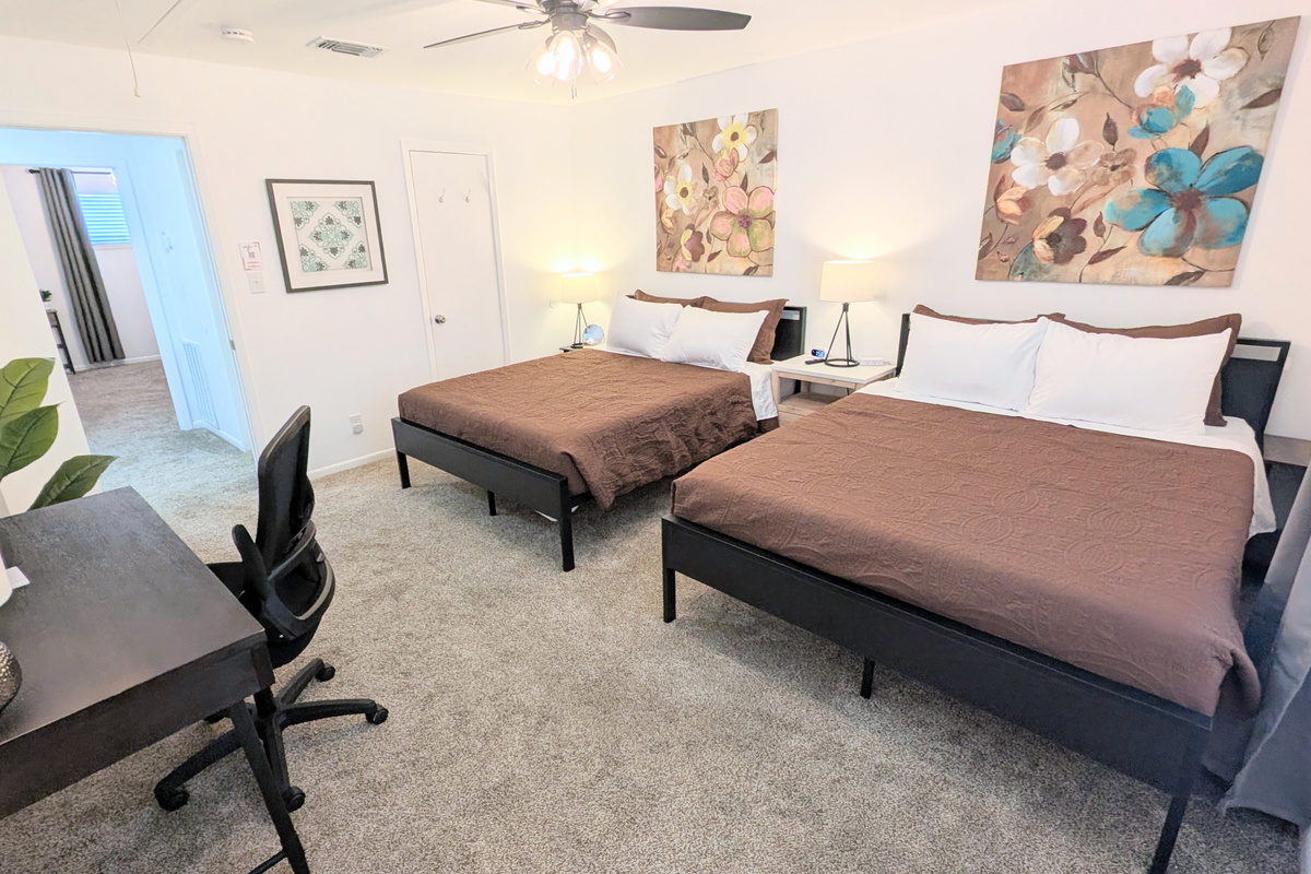 This bedroom features direct access to the bathroom, along with a large closet for ample storage.