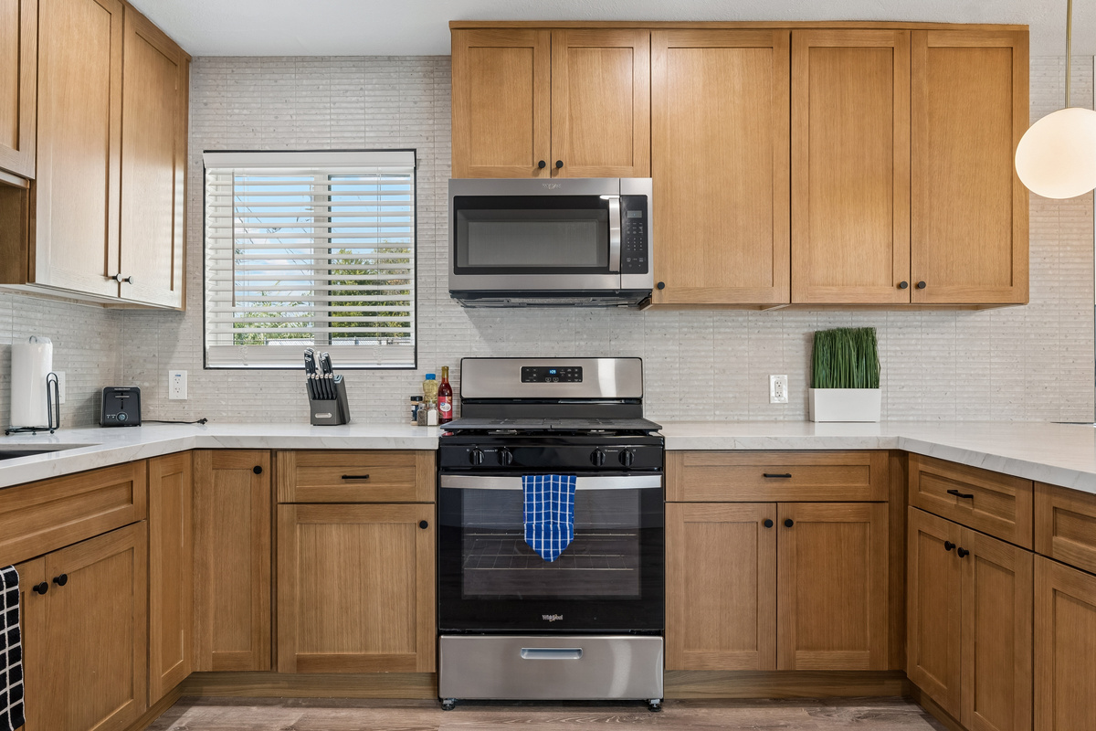 Another view of the stunning kitchen that's full stocked for cooking meals to save on dining out.
