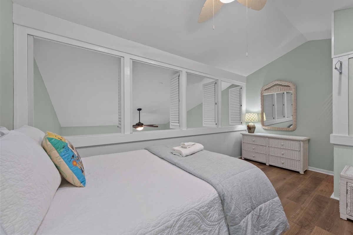 Privacy shutters overlooking the living area while maintaining an open feel
