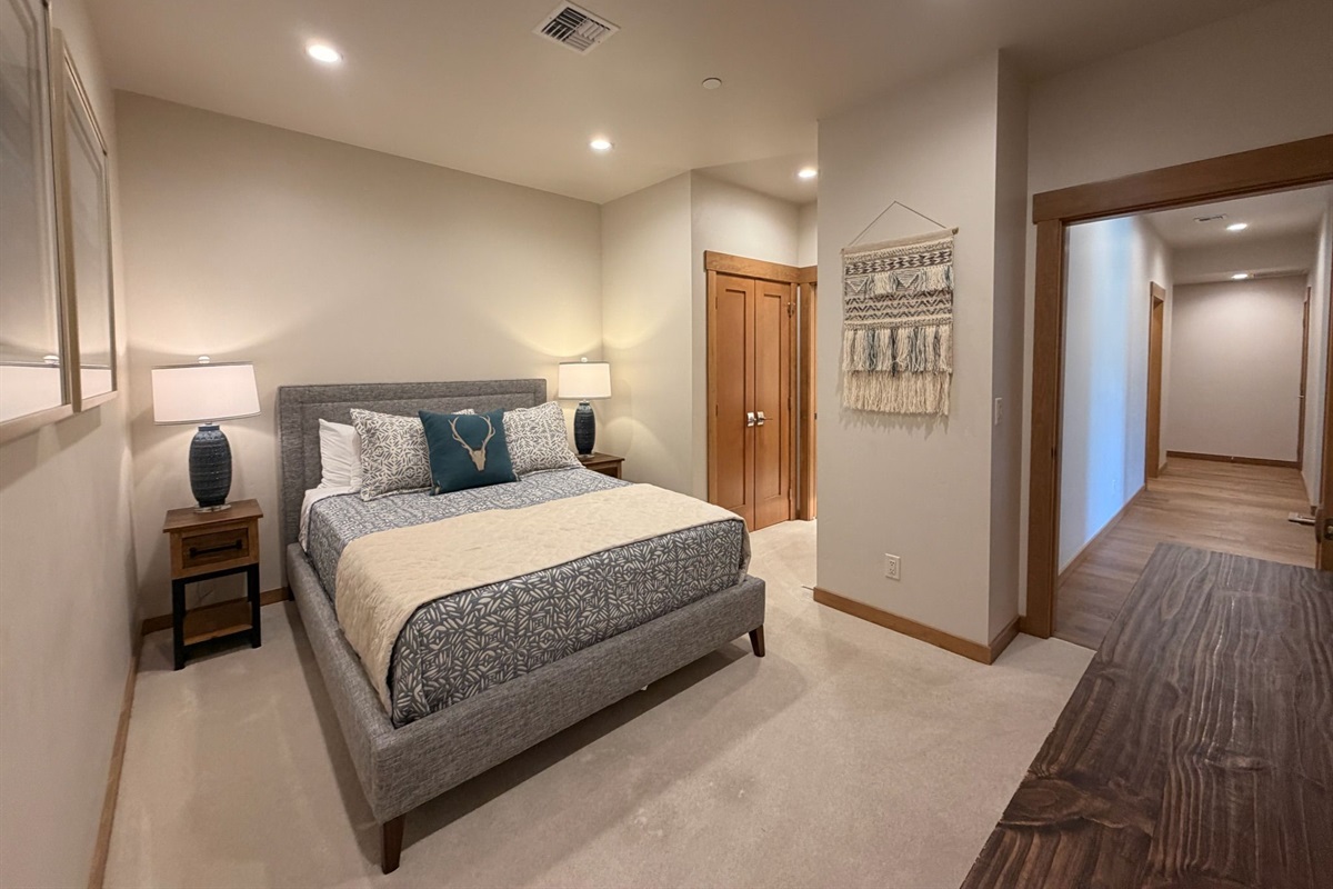 A serene retreat featuring upscale furnishings, soft textures, and modern mountain-inspired décor