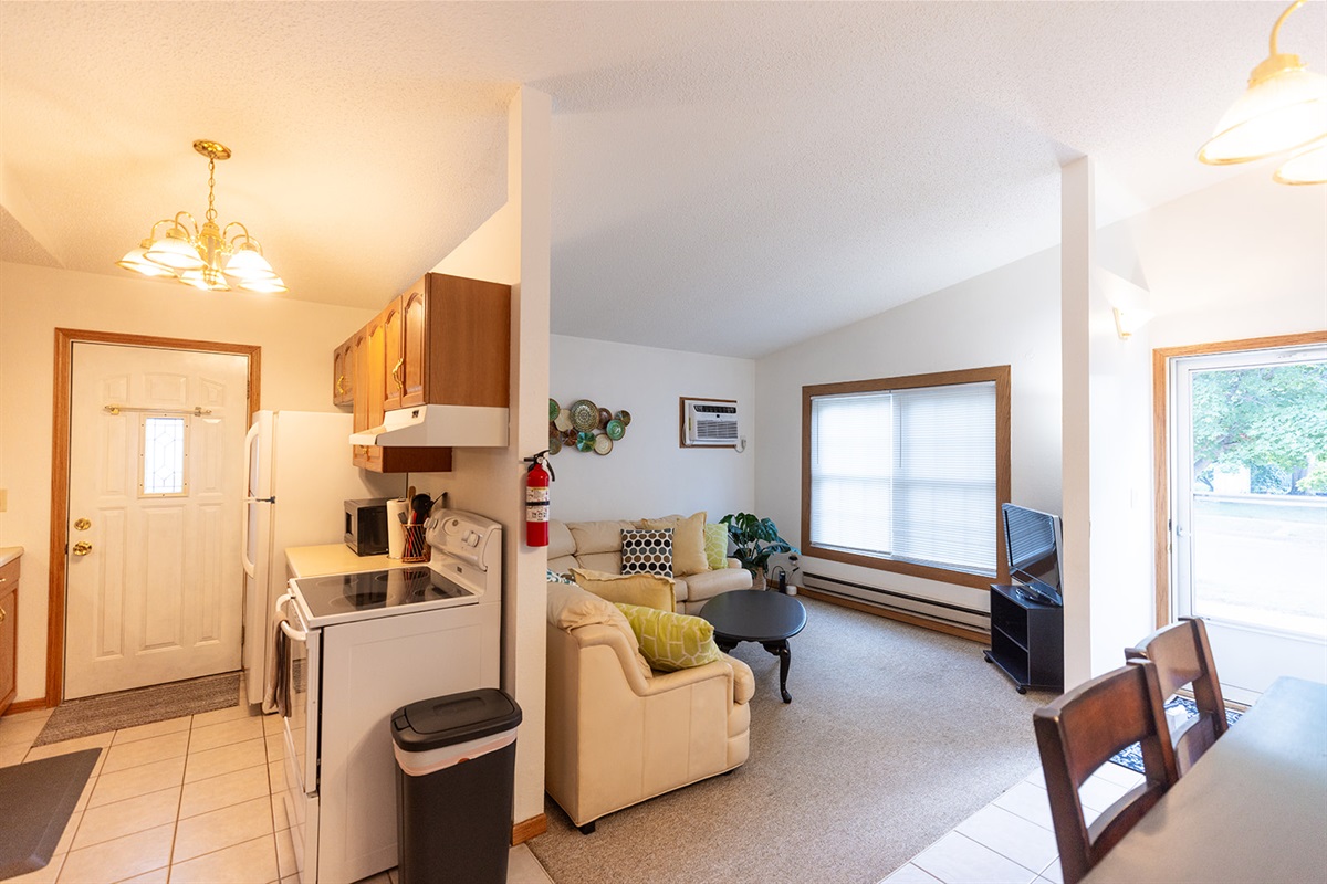 Galley kitchen opens to living room