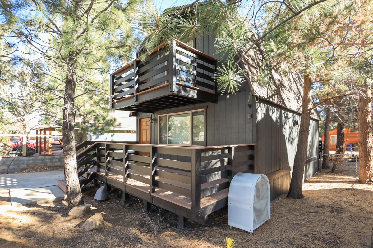 Exterior view of deck and upstairs balcony off the master bedroom.