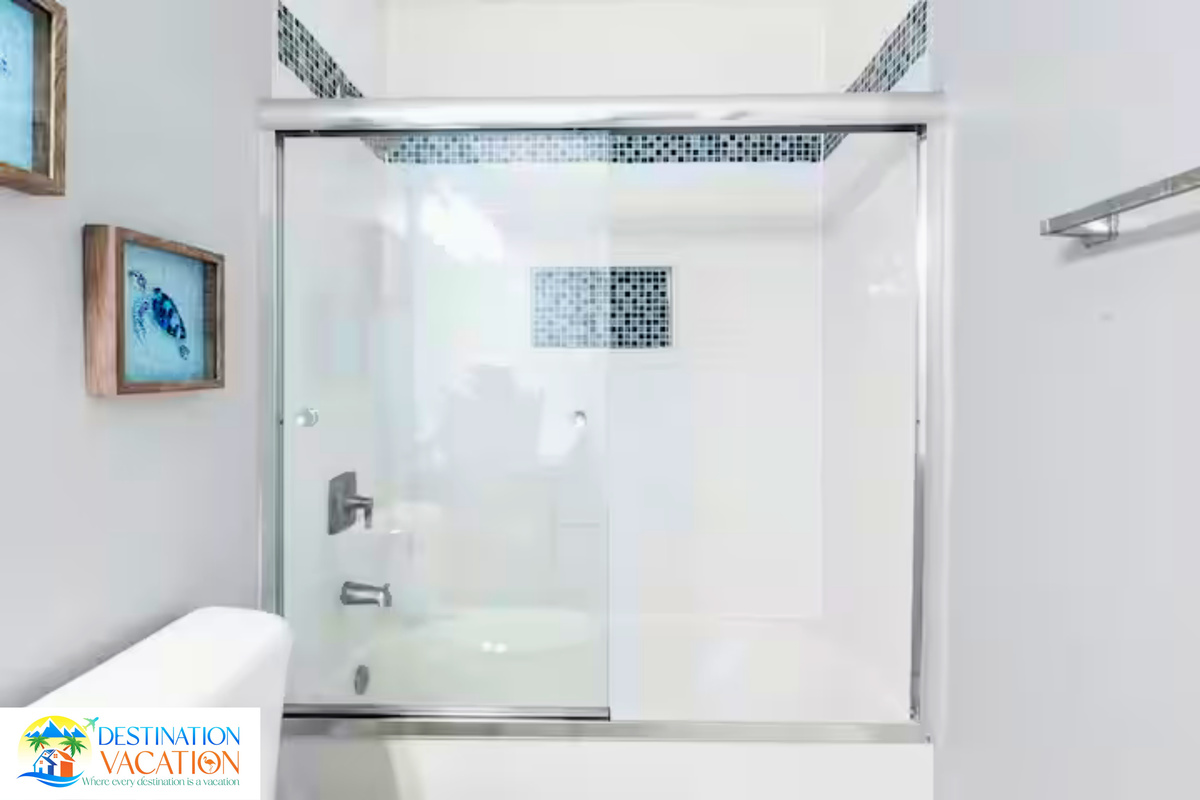 Modern shower details add coastal sophistication.