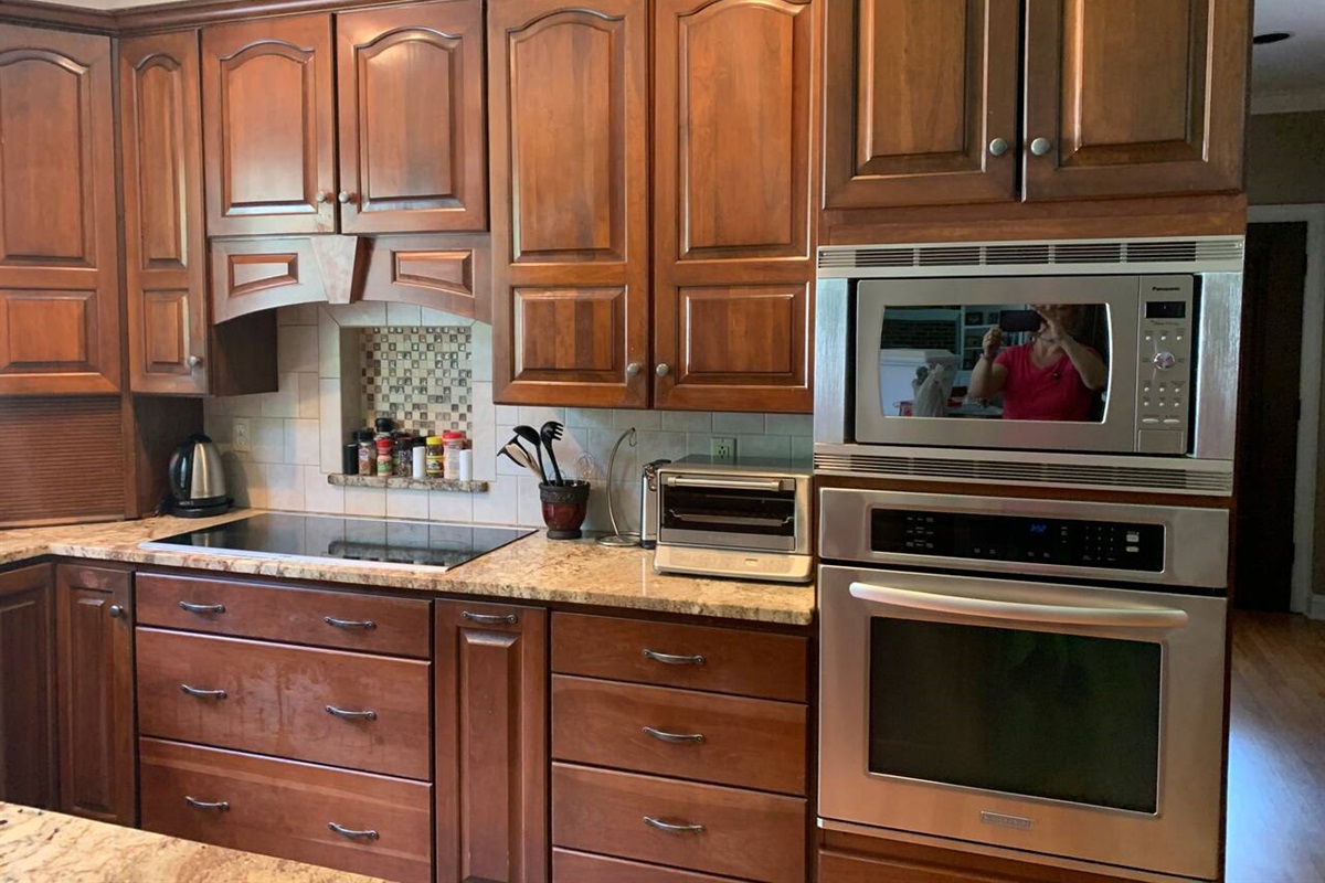 Kitchen close-up of Range, oven, microwave oven and toaster oven. 