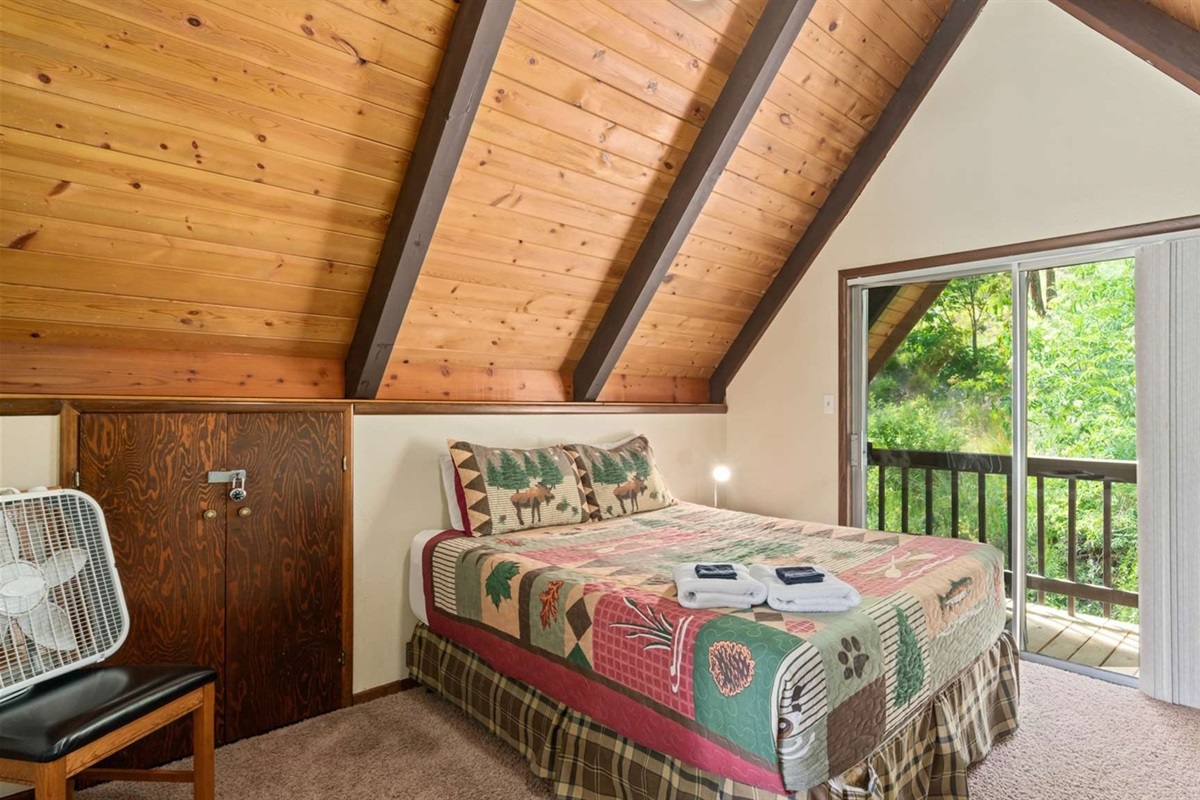 Upstairs loft with extra sleeping space and cozy cabin vibes.