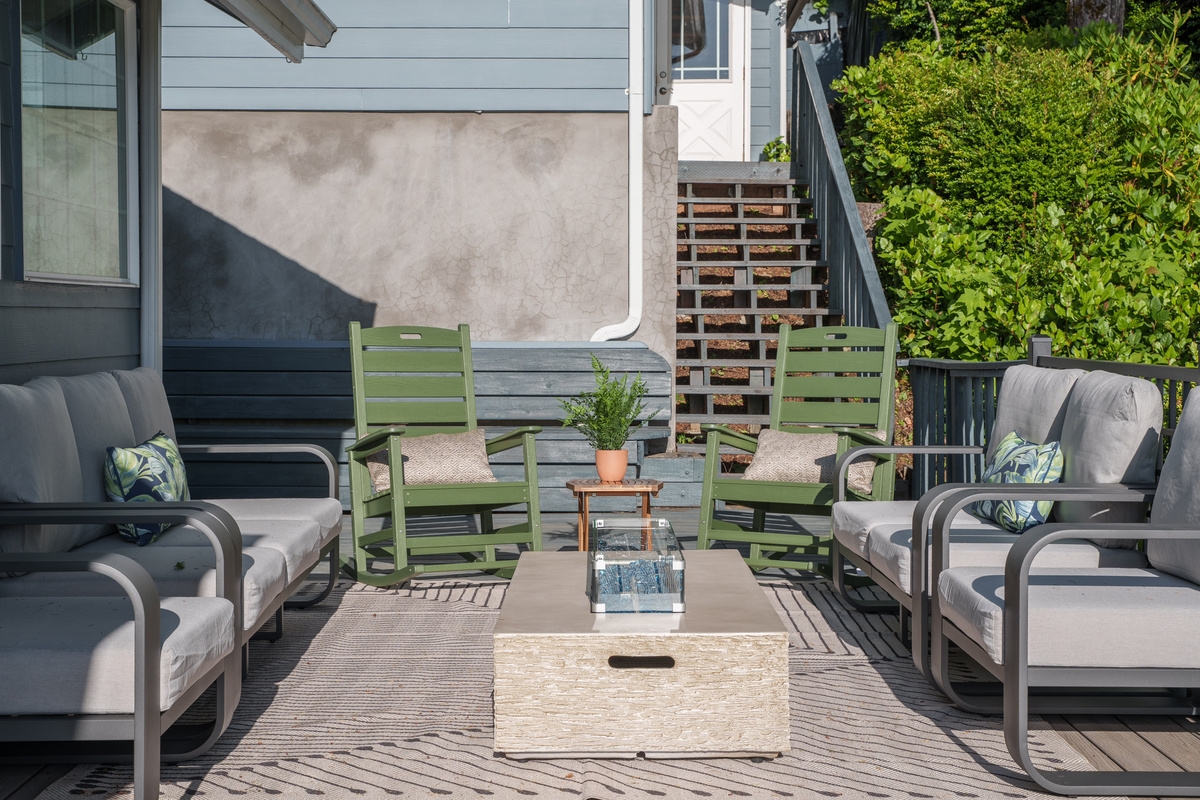 Unwind on the spacious outdoor deck, where comfortable seating and a propane fire pit create the perfect setting for morning coffee, sunset conversations, and cozy evenings together.