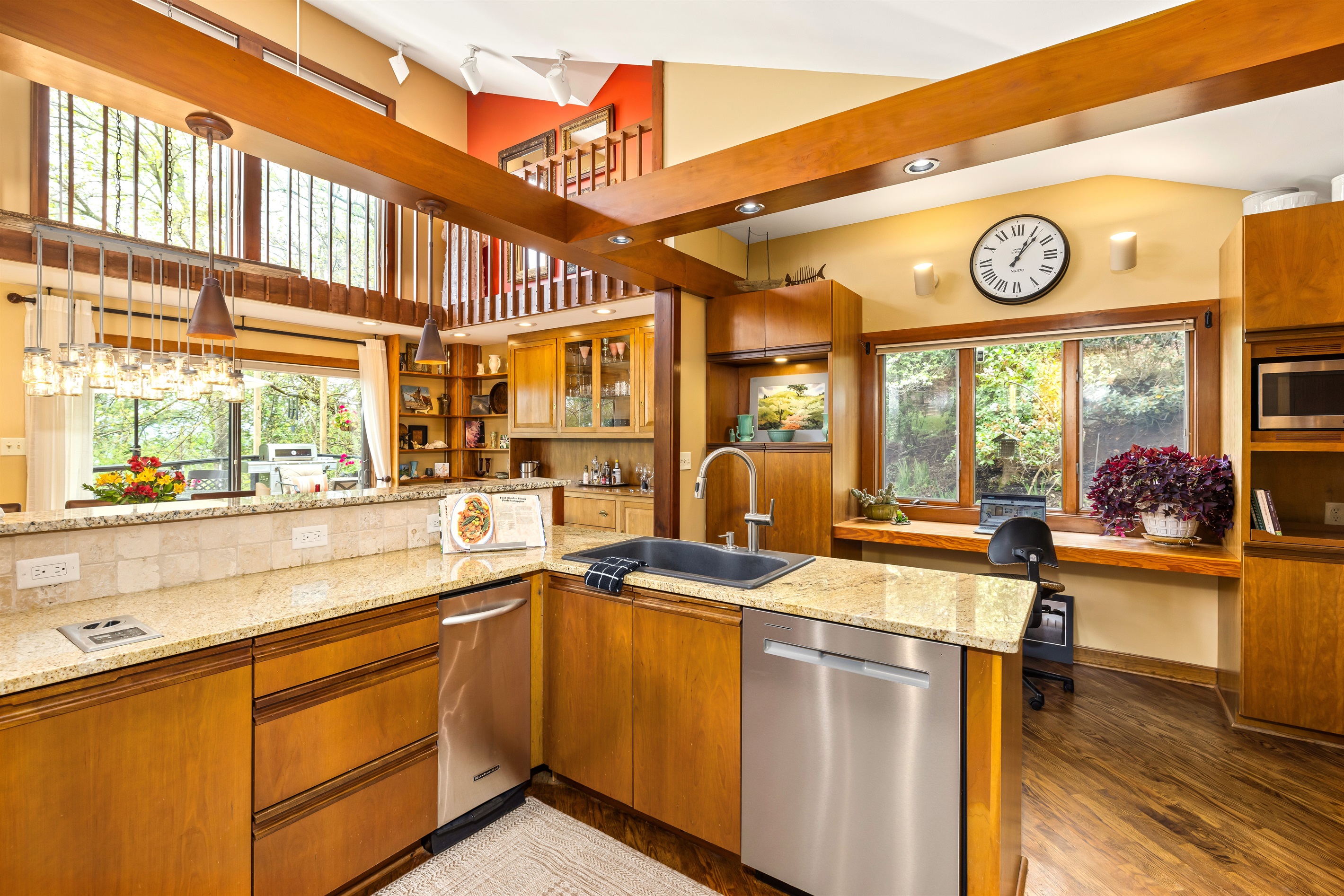 Enjoy views to dining area and main floor deck seating (beyond) while making meals together. See detail photos at end of listing for pots/pans, utensils, dishes, etc.