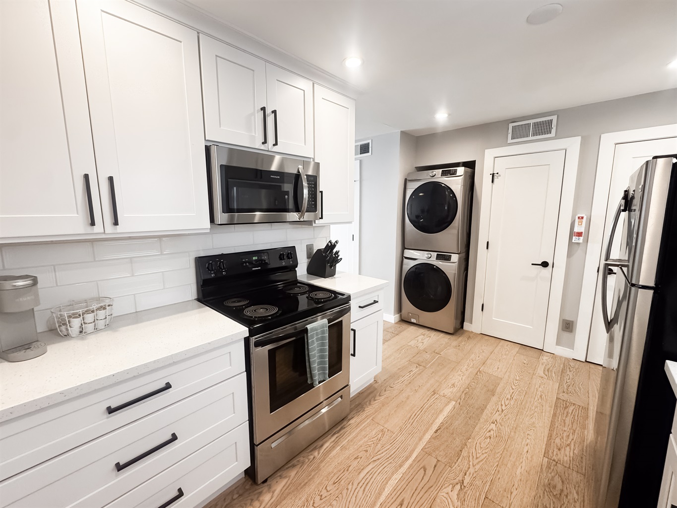 Kitchen with full size water and dryer in unit