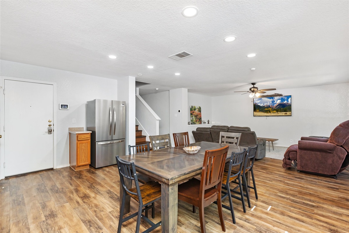 Dining table with seating for 8 people, open to the kitchen and living room for extra space. Easy, social mealtime setup — perfect for families and groups on extended San Antonio stays.