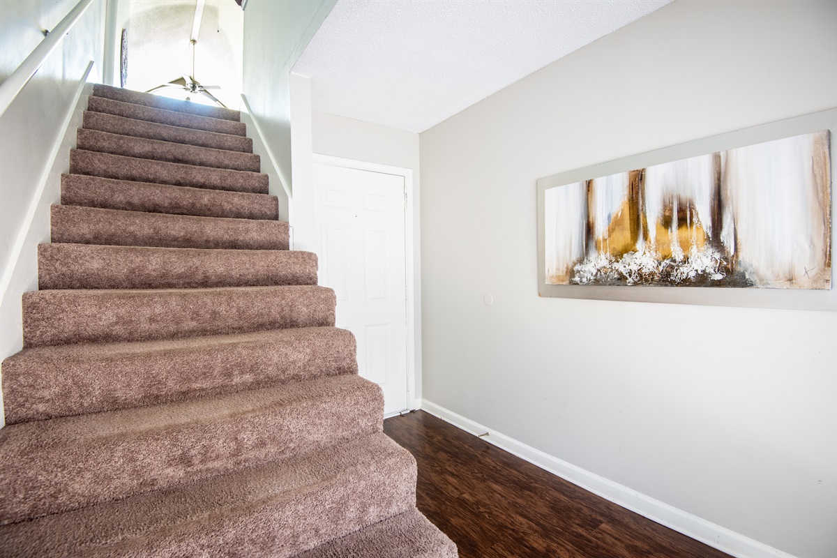Just inside the entry doorway is a staircase that takes you right up into the spaciousness of Unit G!