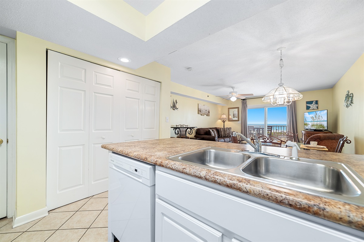 Bright and airy kitchen with ample counter space, modern amenities, and exceptional ocean views, creating an inviting space for cooking and gathering.