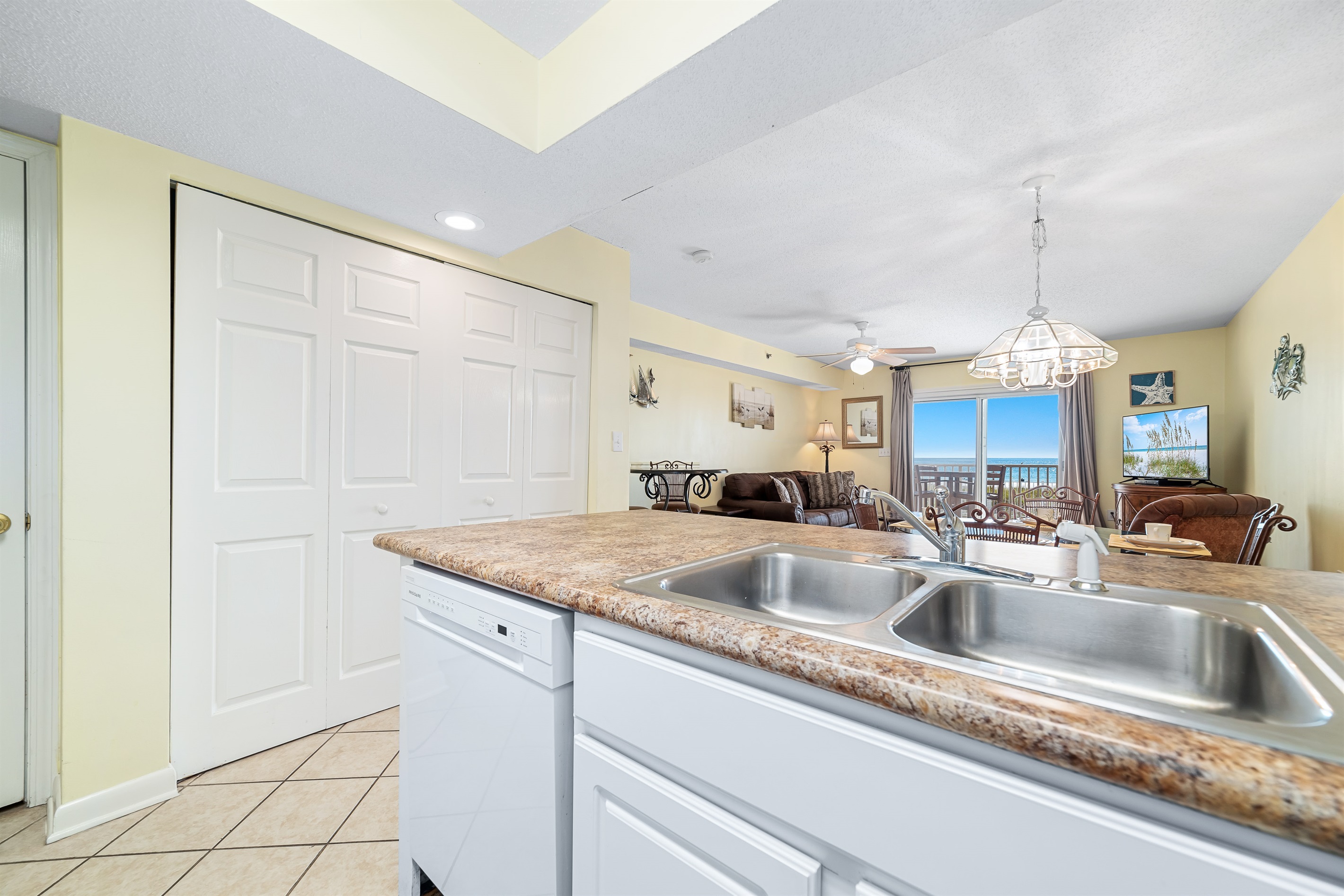 Bright and airy kitchen with ample counter space, modern amenities, and exceptional ocean views, creating an inviting space for cooking and gathering.
