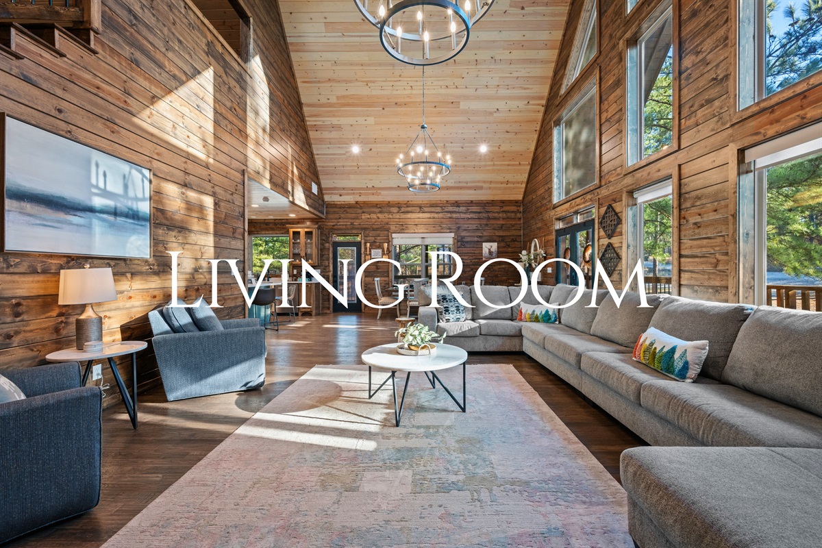 Walking into this living room feels like a breath of fresh air, with soaring ceilings, tons of natural light, and plenty of space to stretch out and relax.
