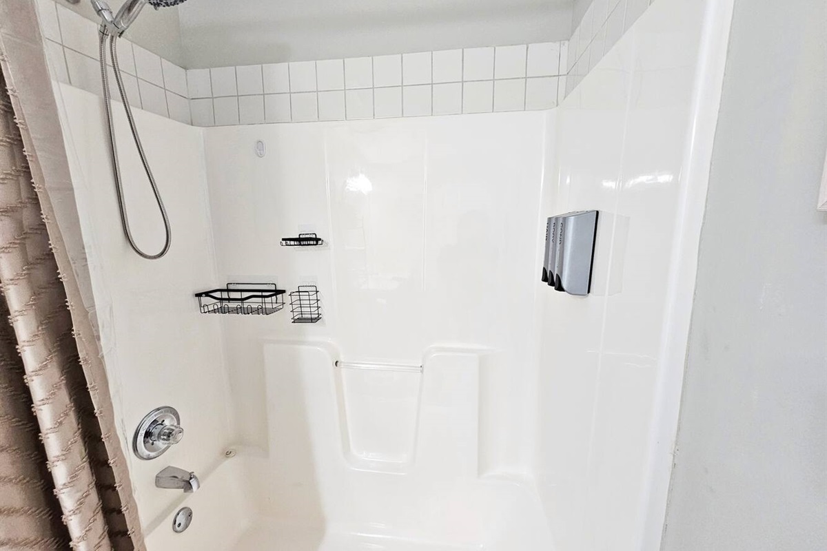 Brand new spa handheld shower head and dispensary. Plenty of in-shower storage as well. 