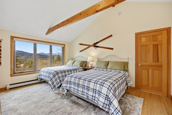 Second floor bedroom with two double beds view 1