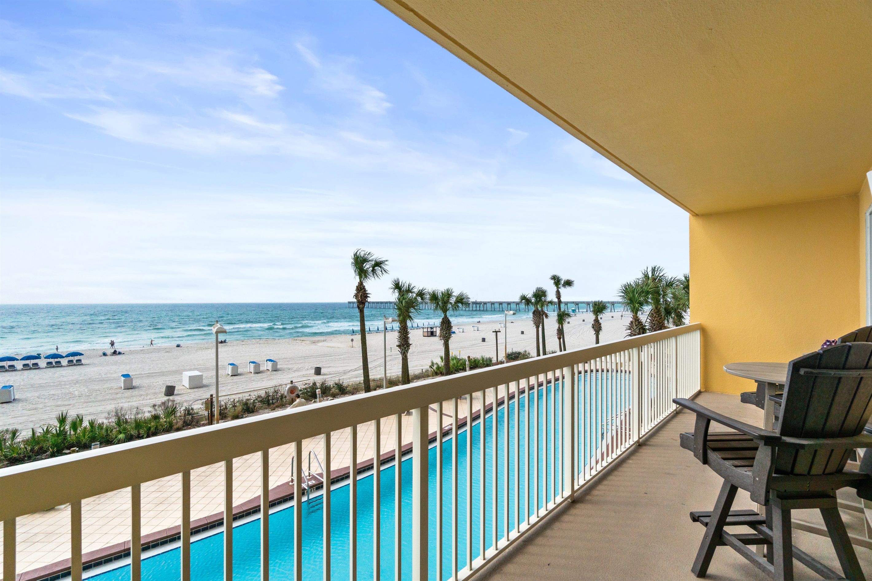 Large balcony overlooking the pool and beach