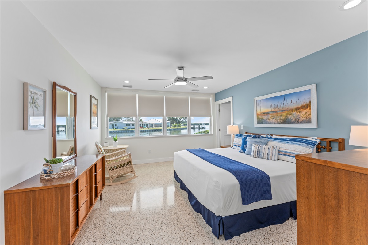 Sunset Suite Primary Bedroom with King bed and view of the canal