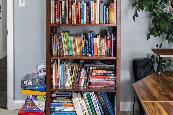 Office Nook: Dive into a world of stories with our charming bookshelf and playful games!
