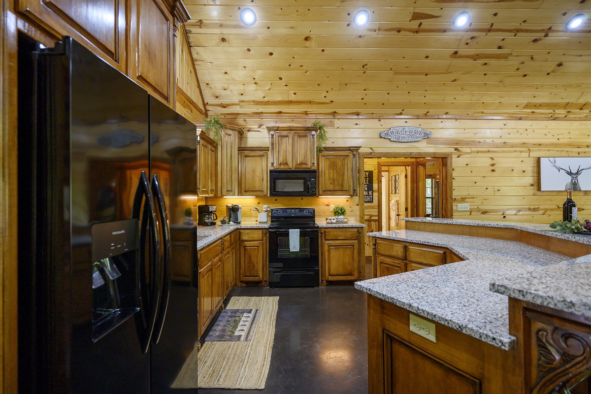 The kitchen is fully stocked with everything you would need to prepare meals.