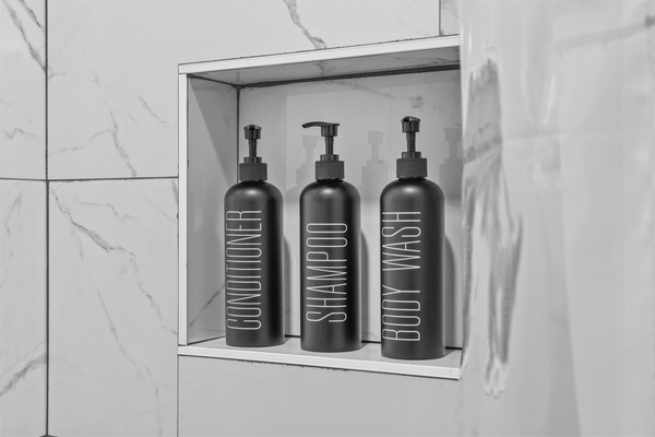 Showers stocked with complimentary amenities.