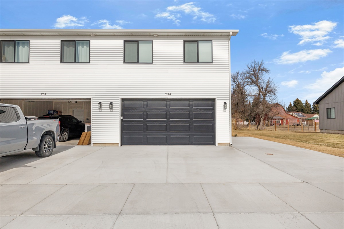 Exterior of home with garage access. 