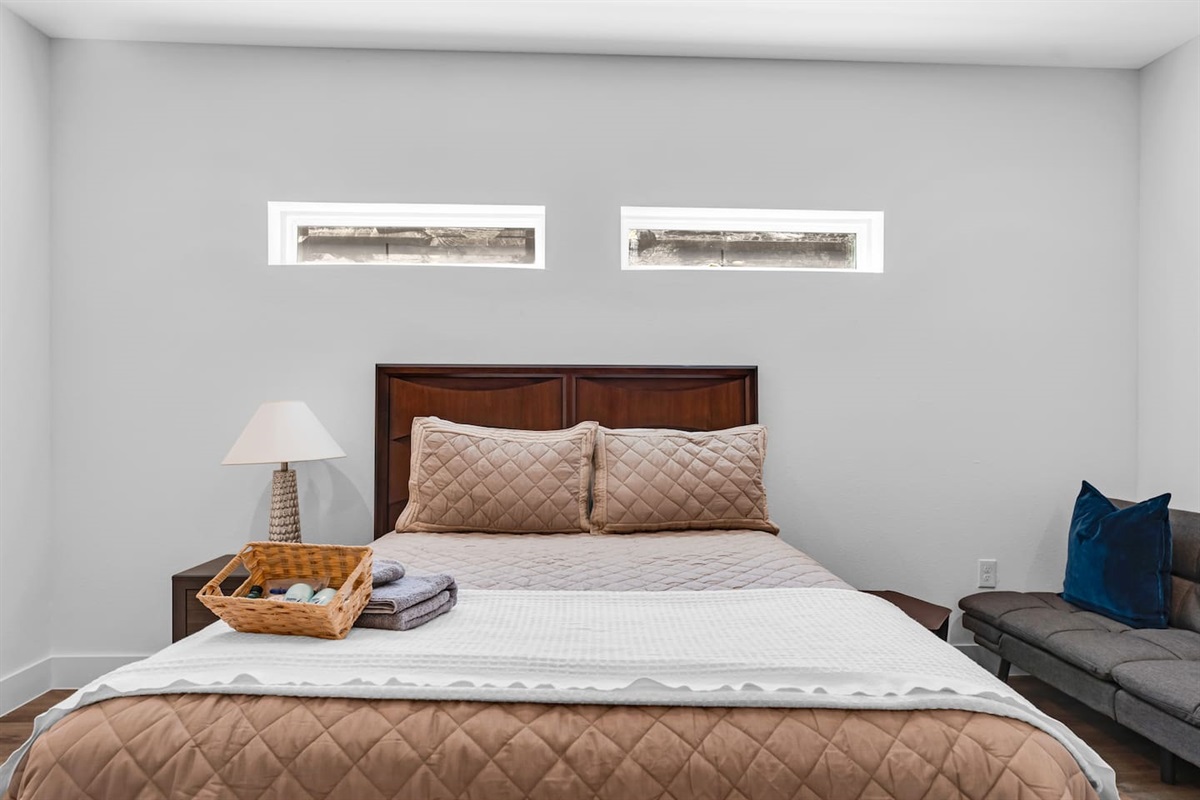Spacious primary bedroom designed for comfort and relaxation.