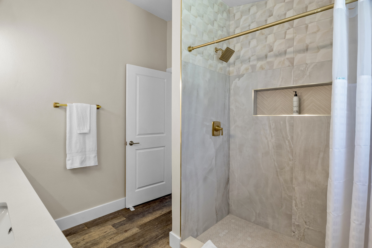 Brushed gold fixtures.