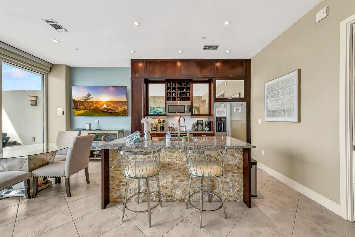 Fully-equipped kitchen with refrigerator, microwave, Keurig, coffee pot, dishwasher, garbage disposal.  Indoor dining!  75-inch LG Smart TV!