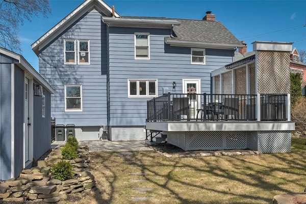 Relaxing expansive rear deck with motorized awning. Awning remote control is inside next to back door as you exit