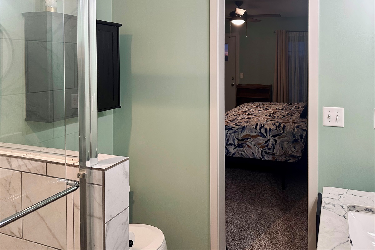 Private ensuite bathroom connected to the primary bedroom, offering convenient access and a seamless retreat-style layout.