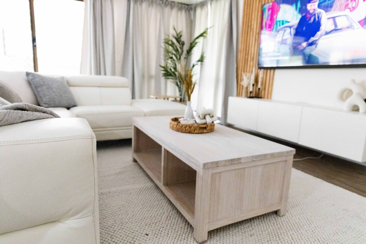 Living room area with a 65inch QLED Smart TV
