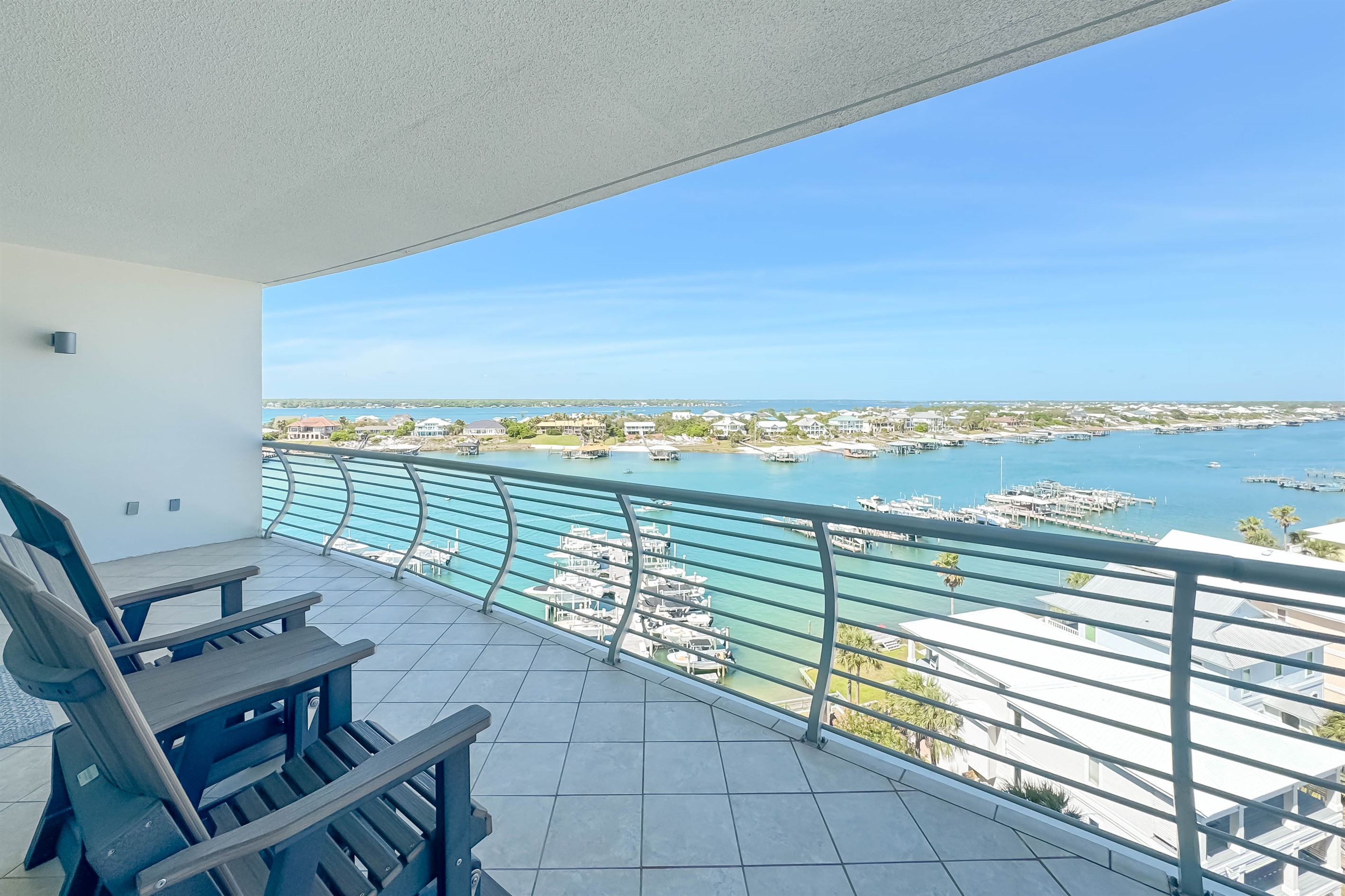 Unwind on this expansive balcony and soak in panoramic water views. A perfect retreat for relaxation and enjoying the coastal breeze.