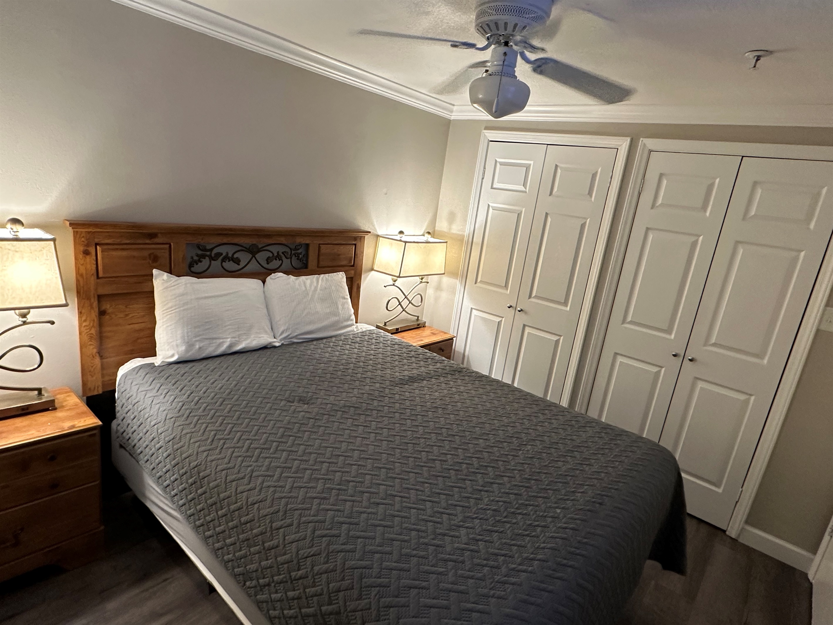The master bedroom features a queen size bed and a large 50" television.