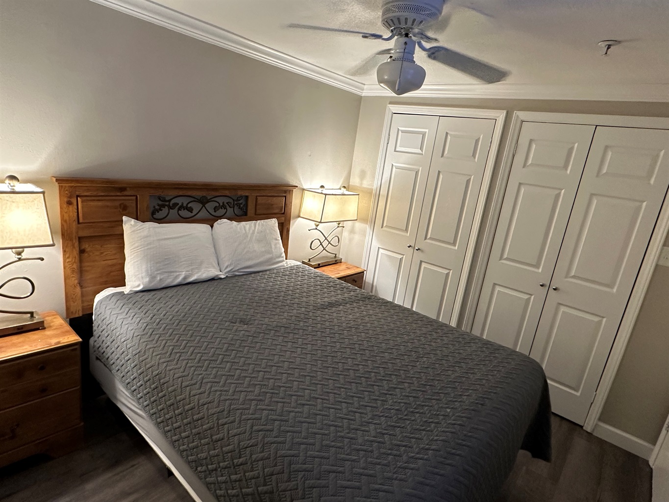 The master bedroom features a queen size bed and a large 50" television.