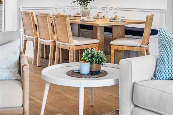 Elegant dining awaits in this beautifully curated space, where natural textures and warm lighting set the scene for memorable gatherings.