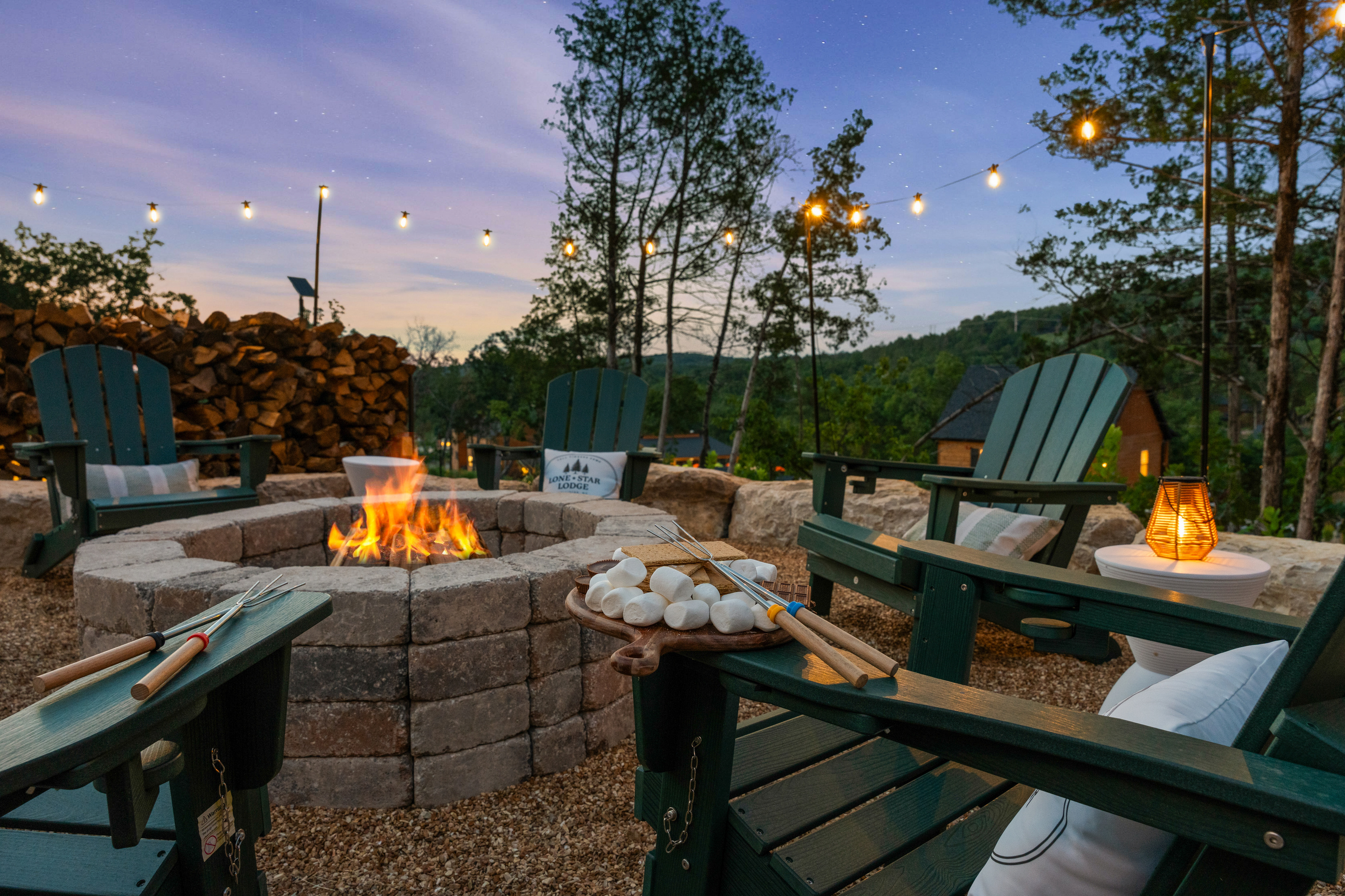 Your very own fire pit for storytelling and s'mores. The fire pit's best hour: flames up, Lone Star Lodge aglow, and the Ozark sky going purple.