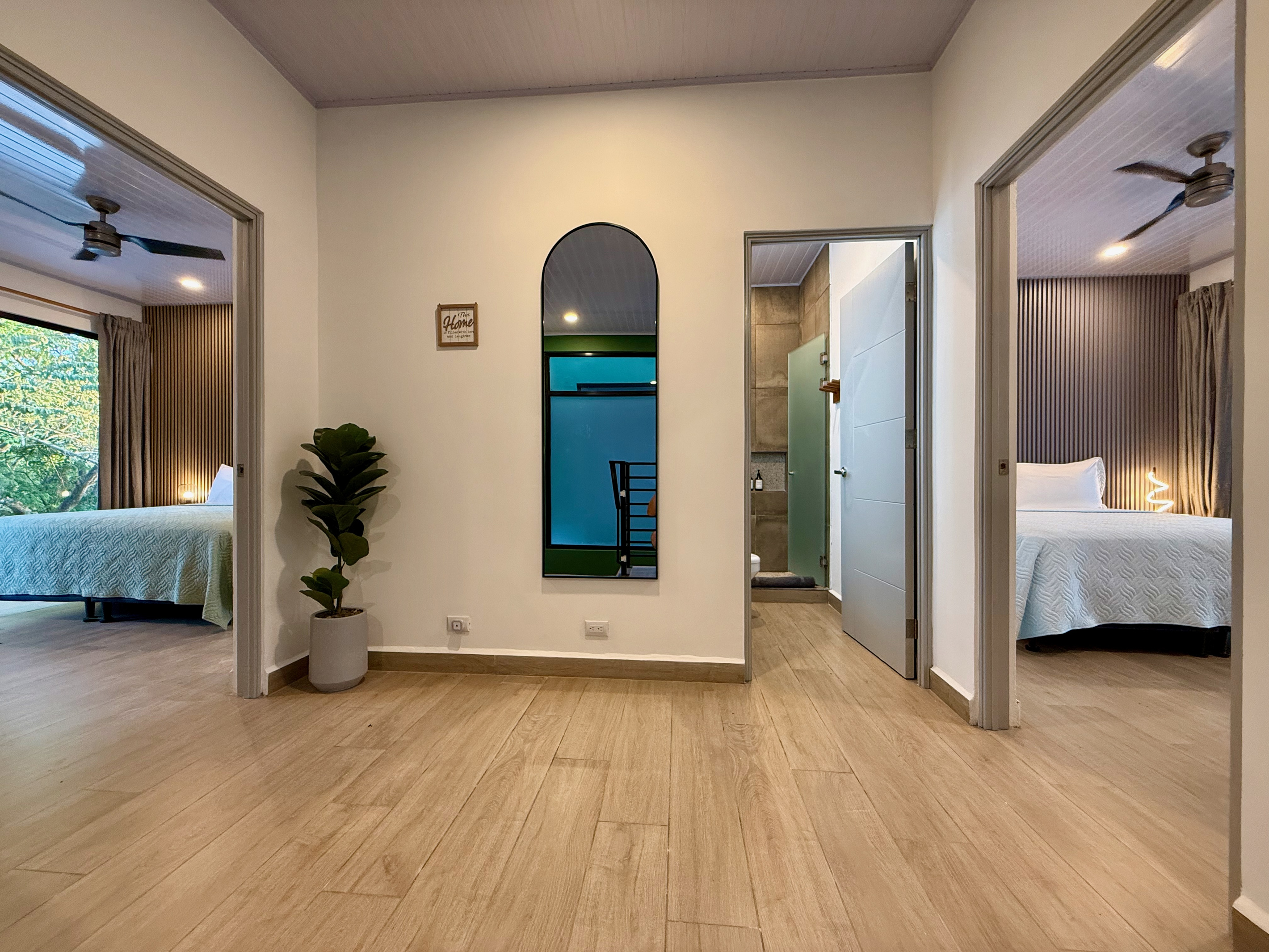 Upstairs — three bedrooms and two full bathrooms off the landing.