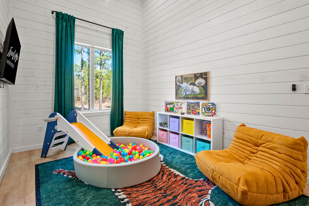 The playroom is a dream for little ones, featuring a ball pit, games, and plenty of space to let their imagination run wild.