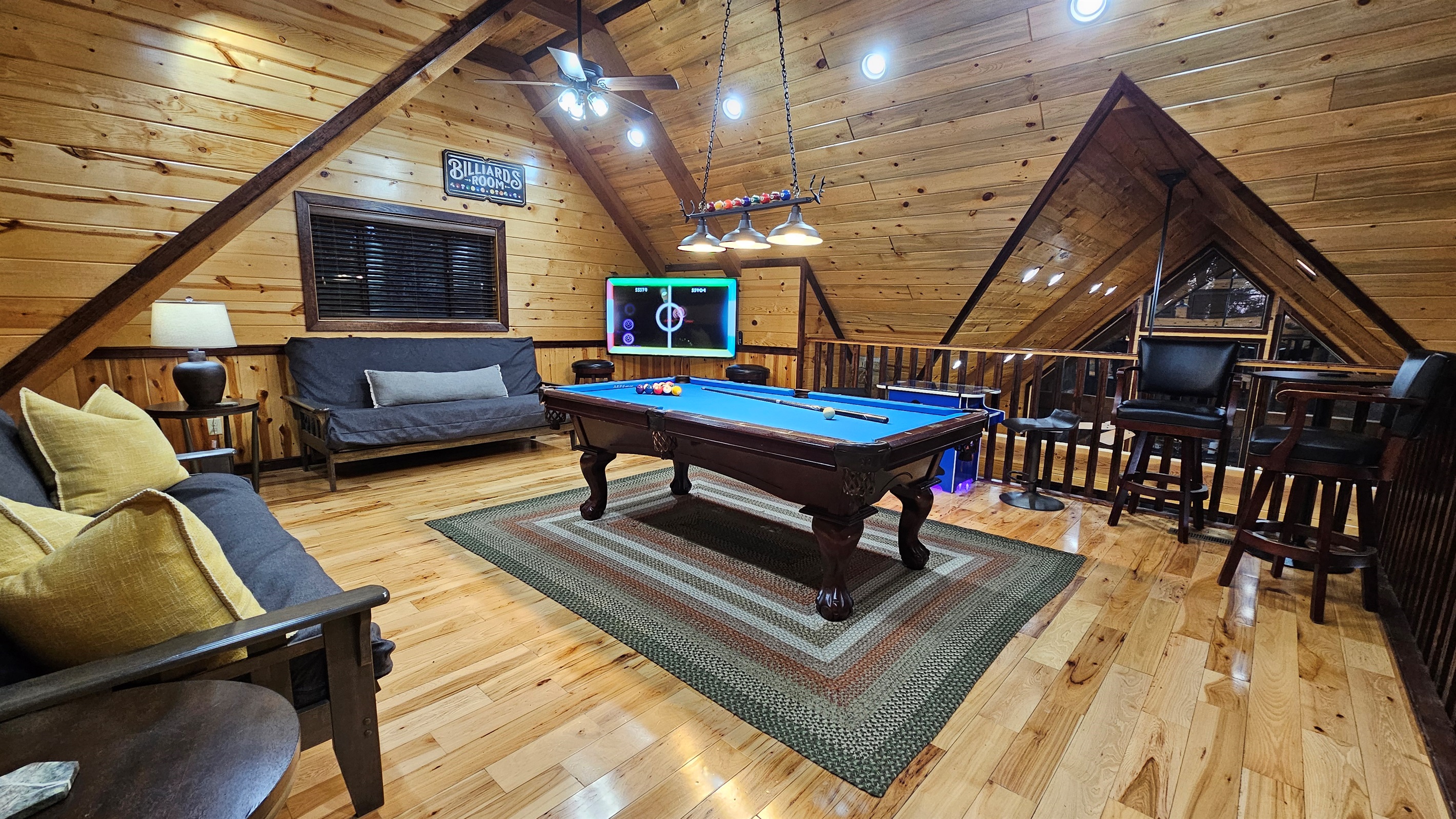 Your nightly hangout: pool table, arcade, and queen sleeper futons for flexible sleeping arrangements.