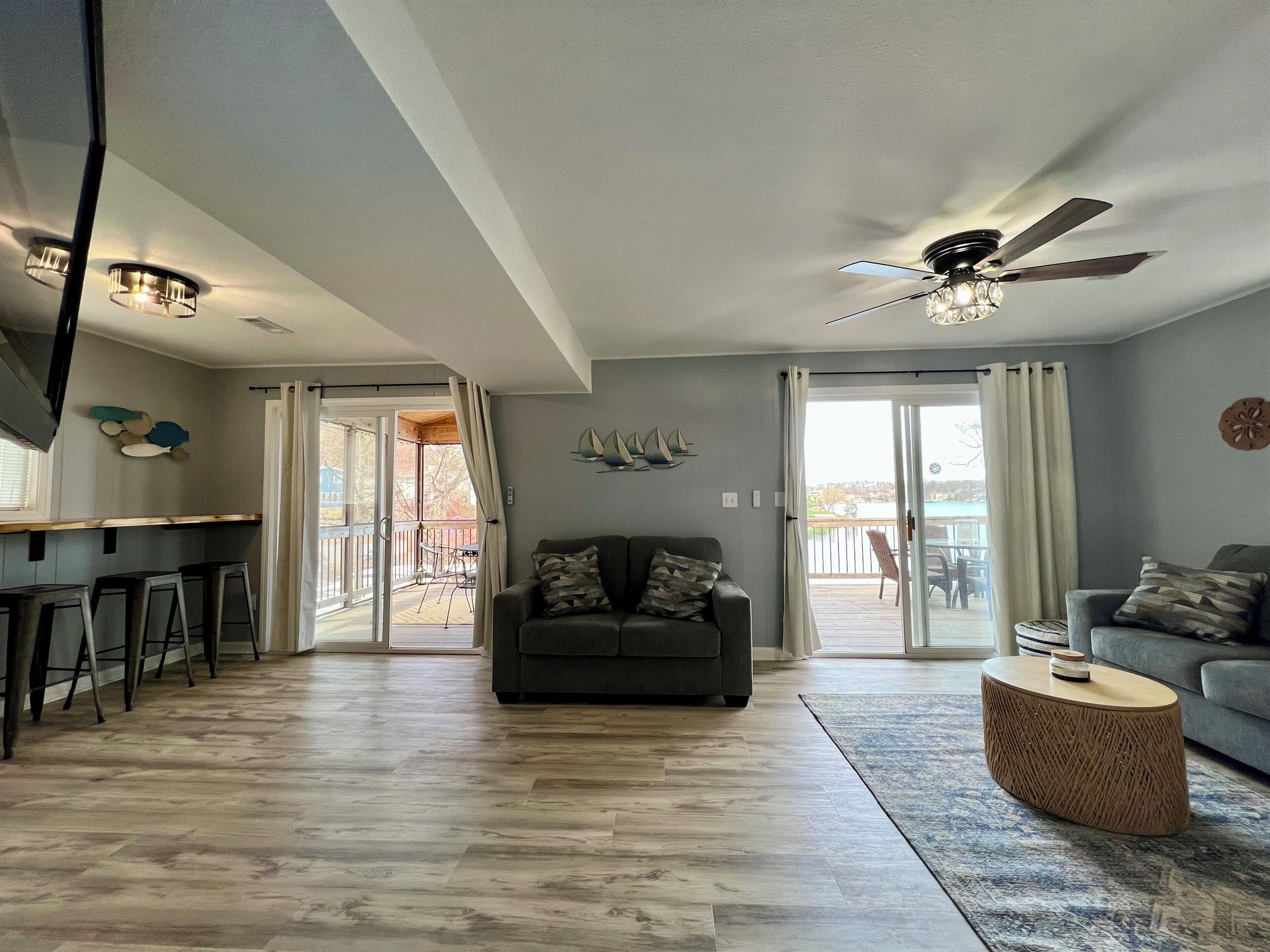 Living Room with queen sofa sleeper and 2 walk-out options.