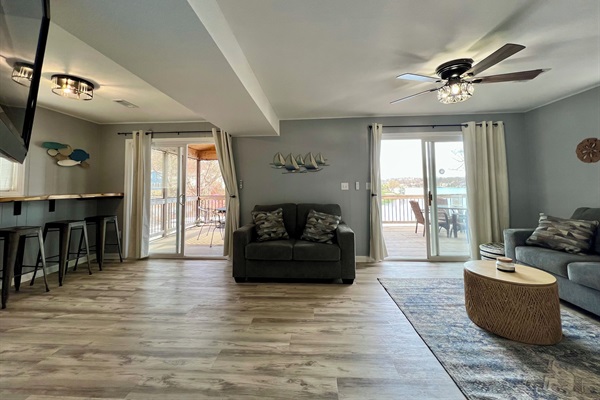 Living Room with queen sofa sleeper and 2 walk-out options.